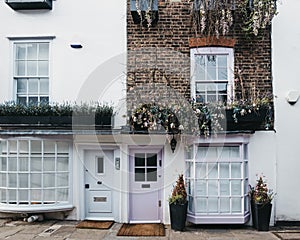 Pastel pink door on an English house in London, UK