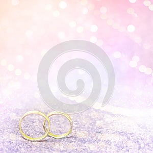 Pastel pink wedding background With Golden Rings