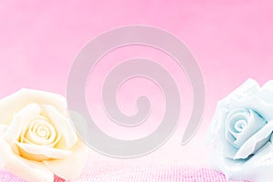 Pastel Rose on pink fabic background