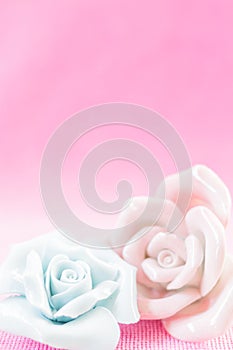 Pastel Rose on pink fabic background