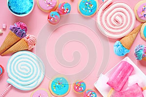 Pastel sweets frame. Top view over a pink background.