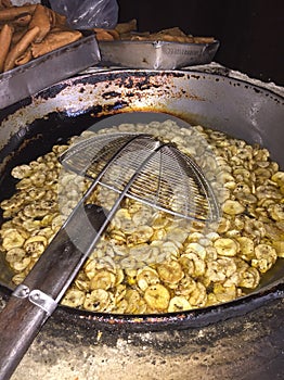 Pasteles de perro traditional corn doug fried snacks on a old carbon based stove