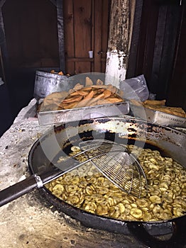 Pasteles de perro traditional corn doug fried snacks on a old carbon based stove