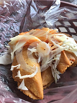 Pasteles de perro traditional corn doug fried snacks on a old carbon based stove photo