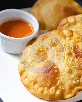 Pastelito traditional venezuelan food with hot sauce