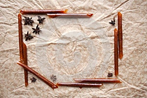 Pastila and star anise frame on paper background