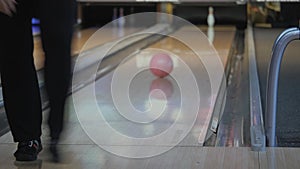 Pastime in bowling. Skating balls on the track with the aim of knocking down pins.