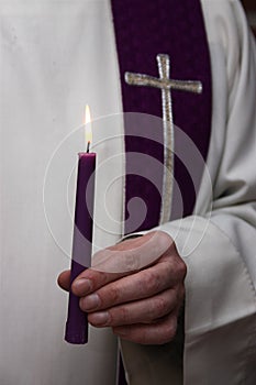 Pastor with candle
