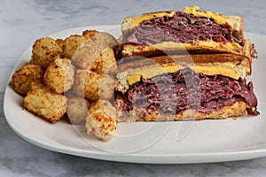 pastrami melt sandwich with tater tots