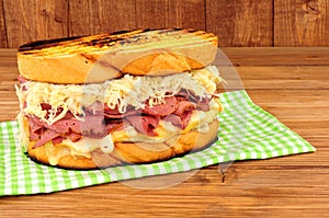 Pastrami Reuben Sandwich On A Wooden Background