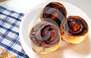 Pastries with cocoa on a white plate