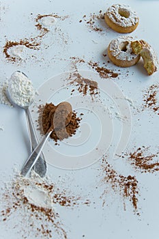 Pastry background two spoons with cocoa, flour and cookies with space for text, menu, recipe