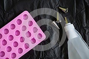 Pastry bag and nozzles on the kitchen on the table, pastry set