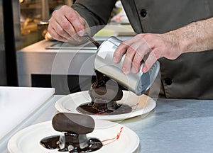 Pastry chef decorating, chef preparing desert chocolate cake