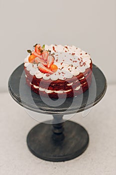 Pastry chef makes delicious red velvet cake. Cooking and decorating dessert