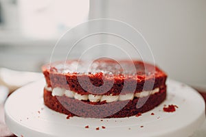 Pastry chef makes delicious red velvet cake. Cooking and decorating dessert