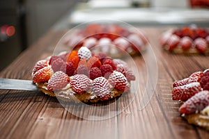 Pastry chef placing a cake