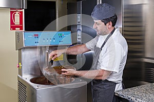 Pastry chef prepares dark chocolates