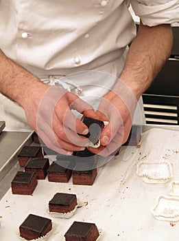 Pastry chef preparing chocolate sweets