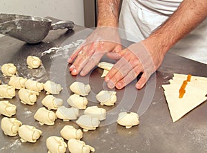 Pastry chef preparing peach marmelade mini briosh