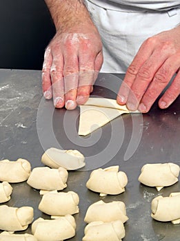 Pastry chef preparing sweets dough