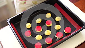 Pastry chef shaping choux au craquelin on a silicone mat