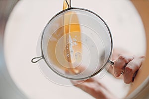 Pastry chef sift pours flour makes cake. Cooking and preparing dessert. Inside bottom view