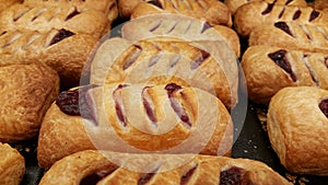 Pastry with cherry on tray