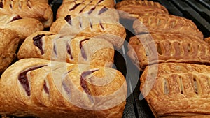 Pastry with cherry on tray