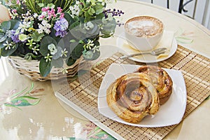 Pastry with coffee in Typical parisian cafe