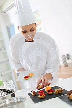 Pastry cook preparing desert