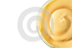 Pastry cream in a bowl isolated on white background photo