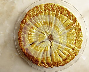 Pastry dough Galette des Rois with cream frangipane with almond