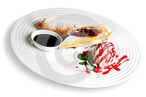 Pastry with ice cream and souce on white plate