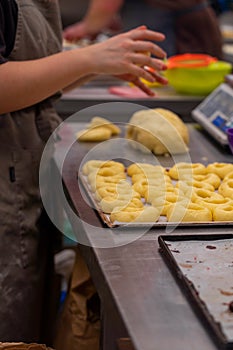 Pastry making donuts by hand photo