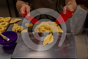 Pastry making donuts by hand photo