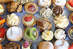 Pastry patisseries with fresh fruit chocolate custard and kiwi photo