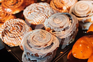 Pastry, selection assortment variety of different bakery, with cinnamon bun, croissant, swiss rolls, cake, eclair and others in a