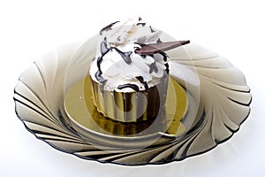 Pastry Tiramisu layered cake in a chocolate cup