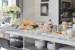 Pastry on white artificial stone top dining table in modern dining room