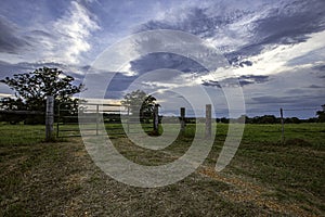 Pasture gate with dramatic sky