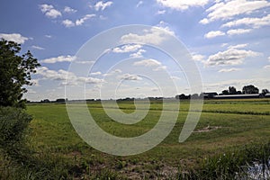 Pastures with farms and roads in the future Fifth Village of the Zuidplaspolder of the municipality of Zuidplas