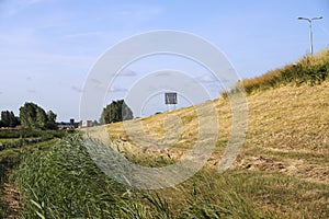 Pastures with farms and roads in the future Fifth Village of the Zuidplaspolder of the municipality of Zuidplas