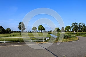 Pastures with farms and roads in the future Fifth Village of the Zuidplaspolder of the municipality of Zuidplas