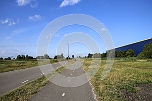 Pastures with farms and roads in the future Fifth Village of the Zuidplaspolder of the municipality of Zuidplas