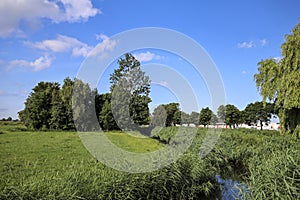 Pastures with farms and roads in the future Fifth Village of the Zuidplaspolder of the municipality of Zuidplas