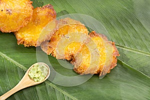 PatacÃ³n fried flattened pieces of green plantain tostÃ³n, tachino