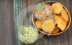 PatacÃ³n fried flattened pieces of green plantain tostÃ³n, tachino