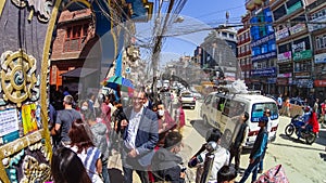 PATAN, NEPAL - April 13, 2018: People going at street in Patan, ancient city in Kathmandu Valley.