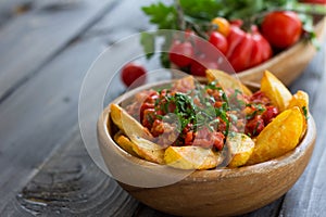 Patatas Bravas, baked potatoes with spicy tomato sauce